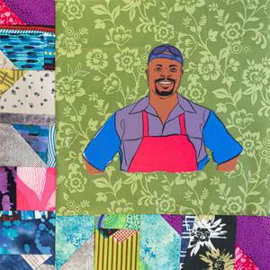 Rodney Scott smiling in a red apron.