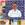Gregory Gourdet smiling in a white apron.