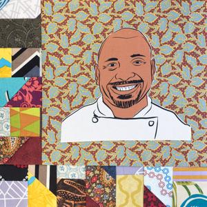 Erick Williams smiling in a white chef coat.