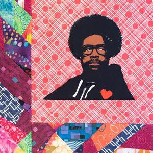 Questlove in a black hoodie with a red heart.