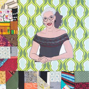 Carla Hall wearing glasses and smiling with her hands folded.