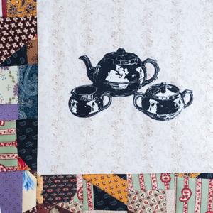 A three-piece tea set.