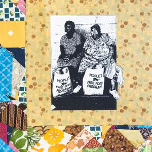 Two women holding bags of food labeled "People's Free Food Program".