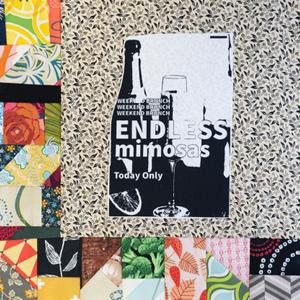 A flyer advertising weekend brunch and endless mimosas.