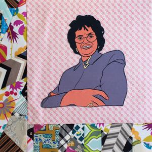 Sylvia Woods smiling with her arms crossed.