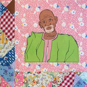 Dr. Sebi in a green top.