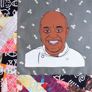 Francois Kwaku Dongo smiling in a white chef coat.