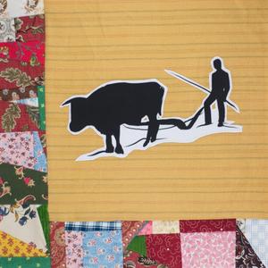 A silouhette of George Granger and a cow.
