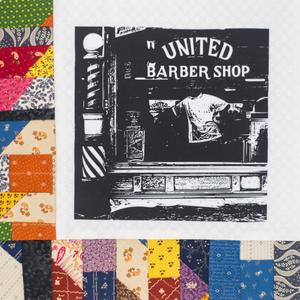 The window of a barber shop.