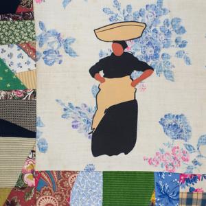 A woman with a basket on her head and hands on her hips.